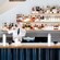 A bartender mixes a drink at a bar